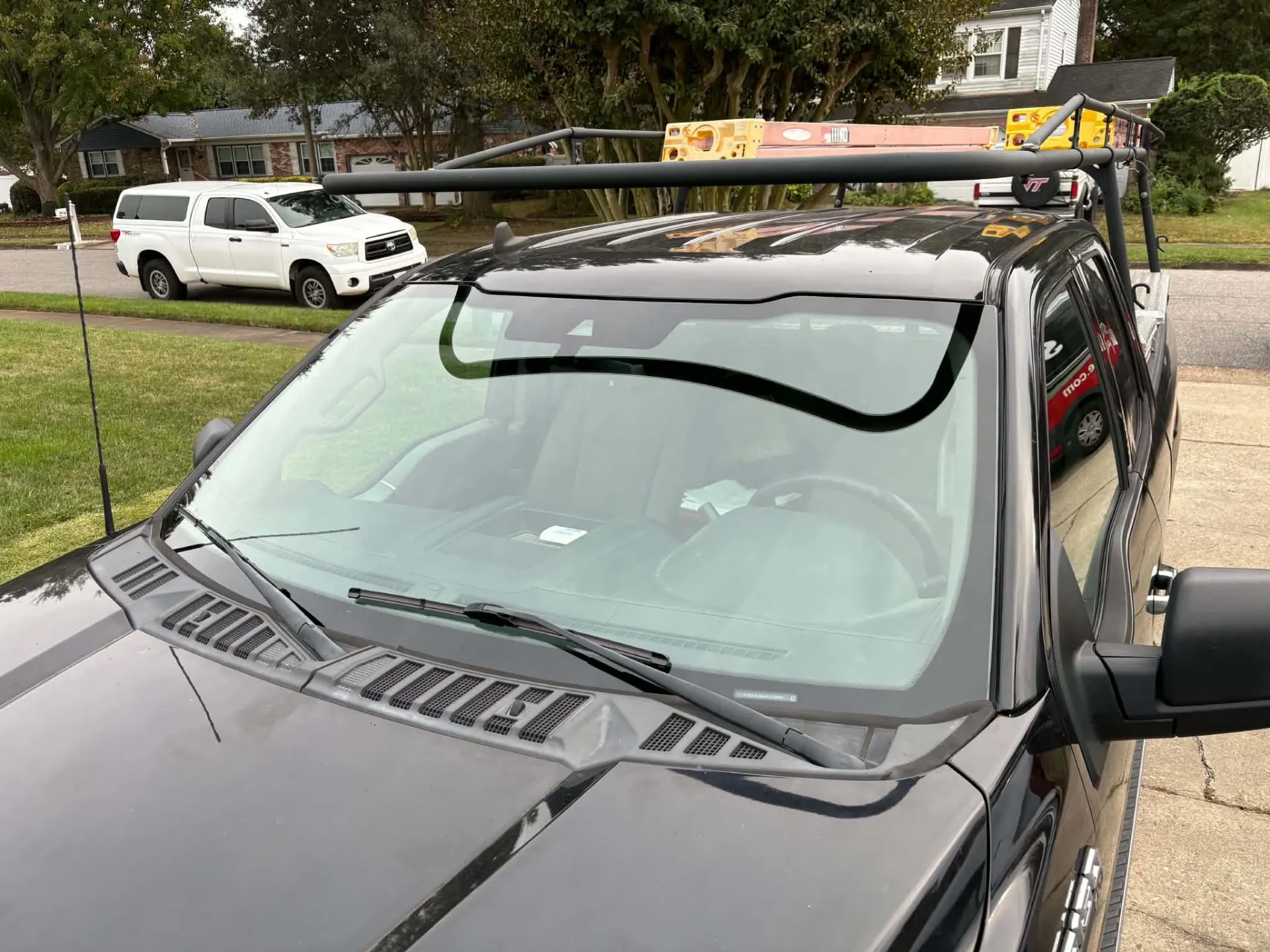 New windshield installed on a black pickup truck in Virginia Beach by Windshield Repairs 4 Less